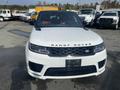 A white 2020 Land Rover Range Rover Sport with a black grille and sleek design facing forward