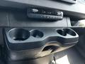 The image shows the interior console of a 2022 Mercedes-Benz Sprinter featuring climate control buttons and a cup holder section