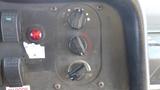 Control panel of a 2011 Ford Econoline with knobs for fans heater and defrost settings along with a red indicator light