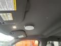 Interior ceiling of a 2017 Ford F-150 featuring a round light fixture and overhead storage compartments