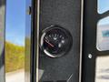 Fuel gauge showing a low level on a 2017 Gehl R105 heavy machinery control panel