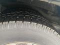 Close-up of a wet tire on a 2018 Chevrolet Express showing detailed tread patterns and texture