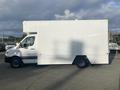 A 2017 Mercedes-Benz Sprinter van with a white box-style cargo area and a black lower section visible from the side