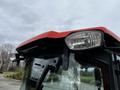 Close-up of the front cab and headlight of a red 2018 Kubota B2650 tractor