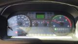 Dashboard of a 2009 Hino 268 showing speedometer tachometer and various warning lights