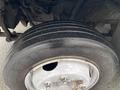 A close-up view of a tire on a 2005 Freightliner MT45 Chassis showing tread patterns and a metallic wheel rim