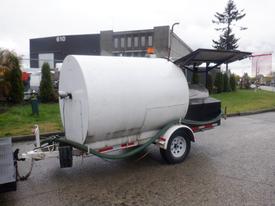 A 2005 Sreco HS 375TR trailer mounted barbecue smoker with a large cylindrical body and a flat top ventilation cover