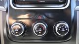 A set of climate control knobs and buttons from the dashboard of a 2014 RAM 3500 including settings for temperature fan and air conditioning