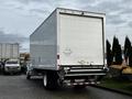 A 2022 Ford F-750 with a large white box cargo area visible from the rear with rectangular tail lights and a loading dock bumper