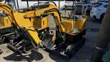 A yellow 2021 Cael-1T Mini excavator with a small bucket and a seated operator's compartment designed for digging and maneuvering in tight spaces