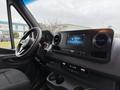 Interior view of a 2019 Mercedes-Benz Sprinter featuring the dashboard steering wheel and touchscreen display
