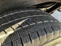 Close-up of a tire from a 2015 Chevrolet Express showing detailed tread patterns and grooves