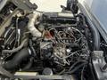 Engine compartment of a 2020 Hino 195 featuring various exposed components including hoses filters and wires