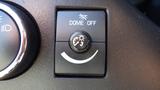 Close-up of a control switch panel featuring the words "DOME OFF" and a circular knob with a smiley face symbol