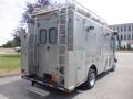 A silver 2007 Morgan Olson Workhorse W42 service vehicle with a ladder and multiple compartments on the rear side