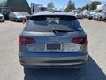 A 2016 Audi A3 viewed from the rear showcasing its sleek design and prominent logo on the trunk