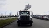 A 2008 International 7500 truck with a bucket lift mounted on the front facing forward