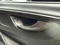 A black door handle and control panel for windows in a 2019 Mercedes-Benz Sprinter