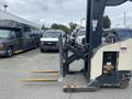 A 2004 Crown RR5210-35 forklift with yellow forks parked in front of several vehicles