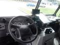 The interior of a 2007 Morgan Olson Workhorse W42 featuring a steering wheel control panel gauges and a monitor