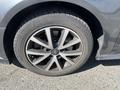 Close-up of a 2016 Audi A3 wheel featuring a dark multi-spoke alloy rim and a low-profile tire