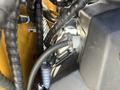 Close-up view of the engine compartment of a 2024 AGT KTT23 Mini Skid Steer featuring visible hoses and components