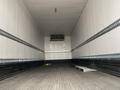 An empty 2018 Hino 308 truck trailer with smooth white walls and a wooden floor featuring a small loading dock at the back