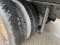 Close-up of a tire and suspension system on a 2018 International 26 Foot Cube truck showcasing air brakes and tread pattern