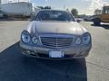 Front view of a silver 2007 Mercedes-Benz E-Class with distinctive grille and headlights