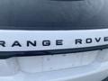 A white 2020 Land Rover Range Rover Sport with a prominent rear badge displaying the text RANGE ROVER