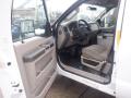 Interior view of a 2009 Ford F-450 SD showing the driver's seat dashboard and door panel