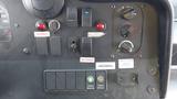 Control panel of a 2011 Ford Econoline featuring various switches buttons and indicators for operations and services