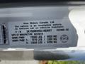 A Hino 195 vehicle identification label displaying the VIN, weight ratings, and manufacturing date