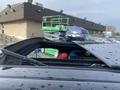 A 2020 Land Rover Range Rover Sport with a partially opened sunroof showcasing the interior and a glimpse of the vehicle's sleek design