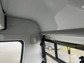 Interior view of a 2017 Chevrolet Express showing a smooth ceiling and mounted equipment along with window and door features