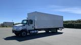 A white 2019 International 4300 box truck with a large cargo area and cab, positioned on a paved surface with no visible cargo