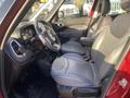 Interior of a 2015 Fiat 500L featuring gray leather seats and a black dashboard with dashboard controls and steering wheel