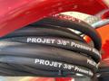 Close-up of black pressure washer hoses labeled Projet 3/8 inch designed for use with a 2024 Magnum 4000 Hot Water Pressure Washer