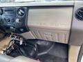 Dashboard of a 2010 Ford F-550 featuring the embossed words SUPER DUTY with various controls and an array of buttons and knobs