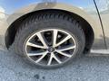 Close-up of a wheel from a 2016 Audi A3 showing a silver alloy rim and a black tire with visible tread marks