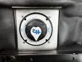 A black and silver control knob with the text "CH" in the center and indicators for "STOP" and "OFF" positions on a metallic plate