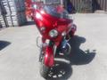 A 2017 Indian Chieftain Elite motorcycle with a glossy red finish featuring prominent front lights and a distinctive design