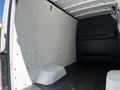 Interior of a 2022 Mercedes-Benz Sprinter van showing a spacious cargo area with white walls and a black floor