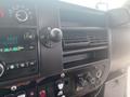 Dashboard of a 2017 Chevrolet Express featuring a radio display air vents and control buttons for various vehicle functions