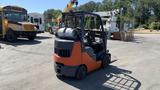 A 2018 Toyota 8FGCU25 forklift with a black and orange body and a lifting mechanism in the front