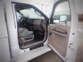 Interior view of a 2008 Ford F-550 showing the driver's seat dashboard and open door