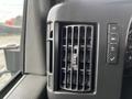 Close-up of a dashboard air vent in a 2017 Chevrolet Express with control buttons for air settings