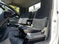 Interior view of a 2020 Hino 195 showing two cloth seats and the steering wheel in the foreground