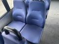 Interior view of blue fabric seats in a passenger van designed for comfort and utility