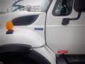 A white 2008 International 7400 truck showing the front with an orange turn signal and a label indicating diesel fuel only